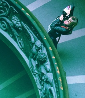 Photographer taking photos on a spiral staircase