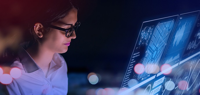 Lady looking at her blue computer screen