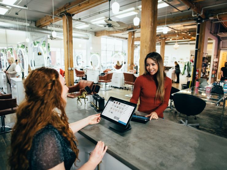 Two woman standing at a counter